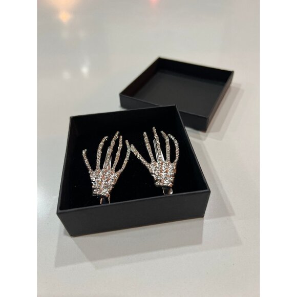 Accessories - Rhinestone skeleton hand hair clips, a popular gothic accessory.